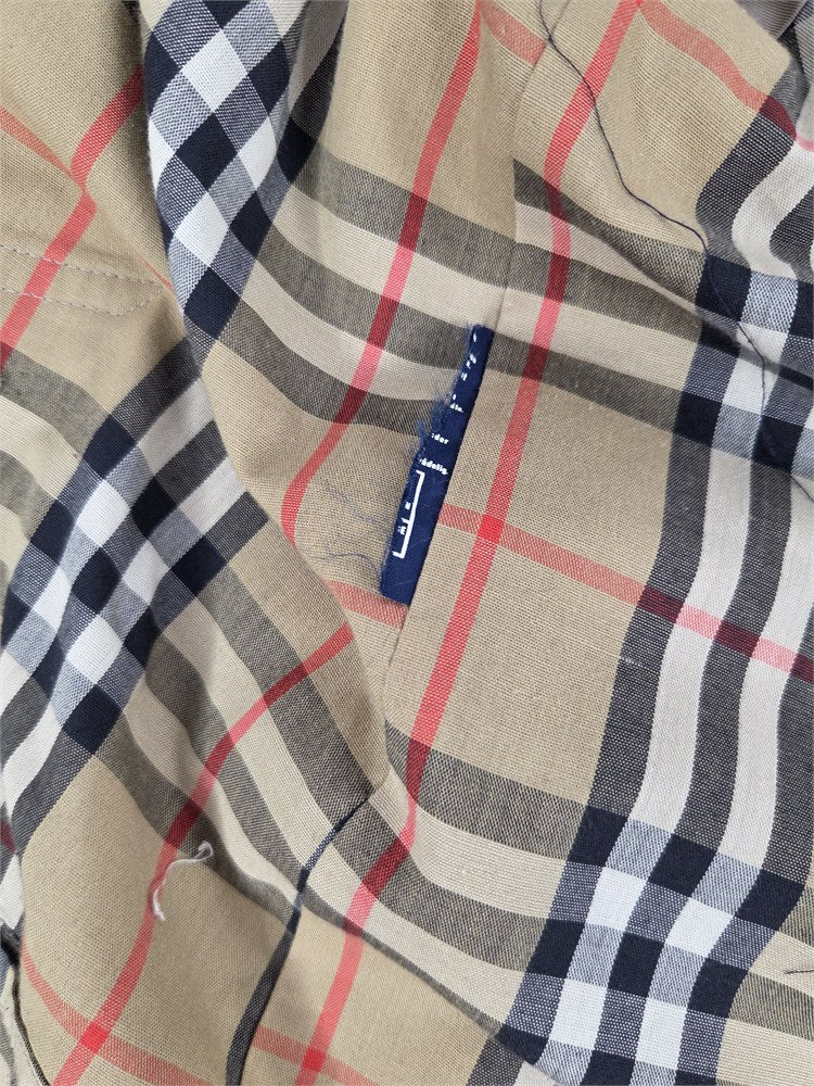 Burberrys trench interior checked lining and care label detail