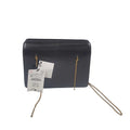Black leather crossbody bag with gold-tone chain strap view 1