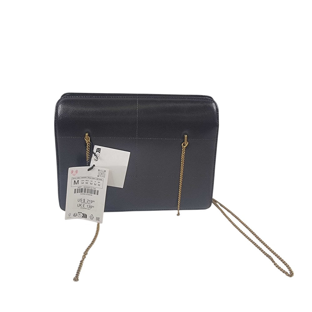 Black leather crossbody bag with gold-tone chain strap view 1