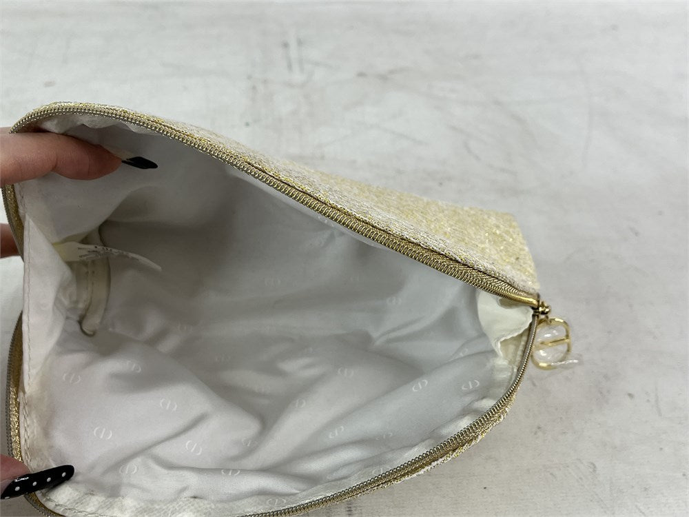 Christian Dior limited edition gold holiday cosmetic pouch interior view
